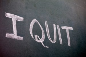 Hand written "I Quit" on a greenboard
